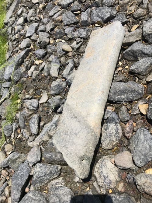 A stone worked into a sill or stair tread